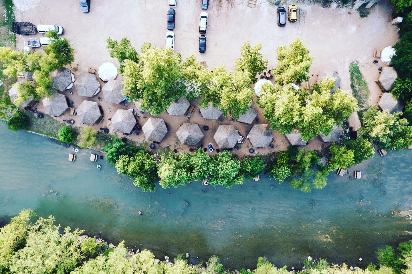 Aerial view of cabanas along the river