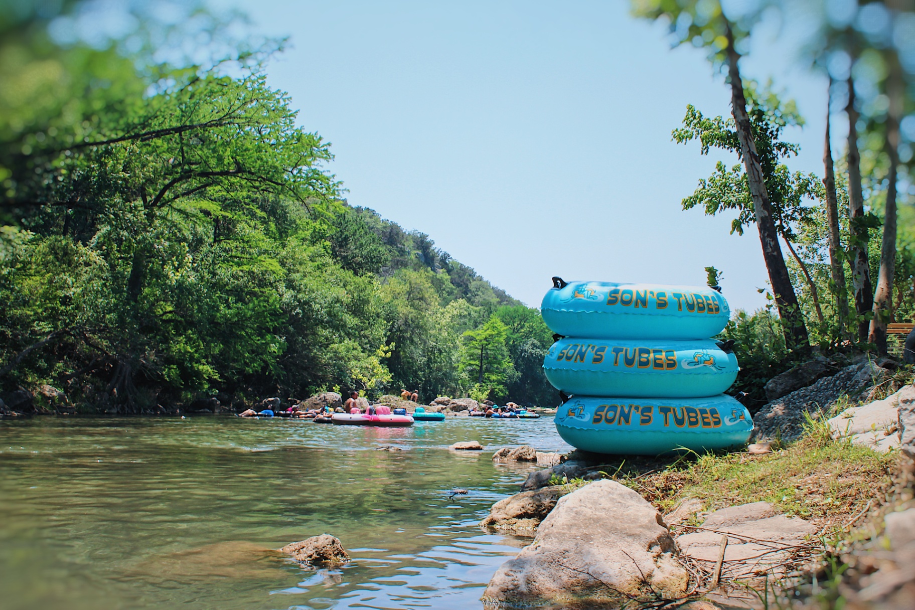 Son's Tubes stacked by the river