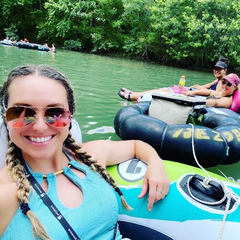 Friends taking a selfie while tubing